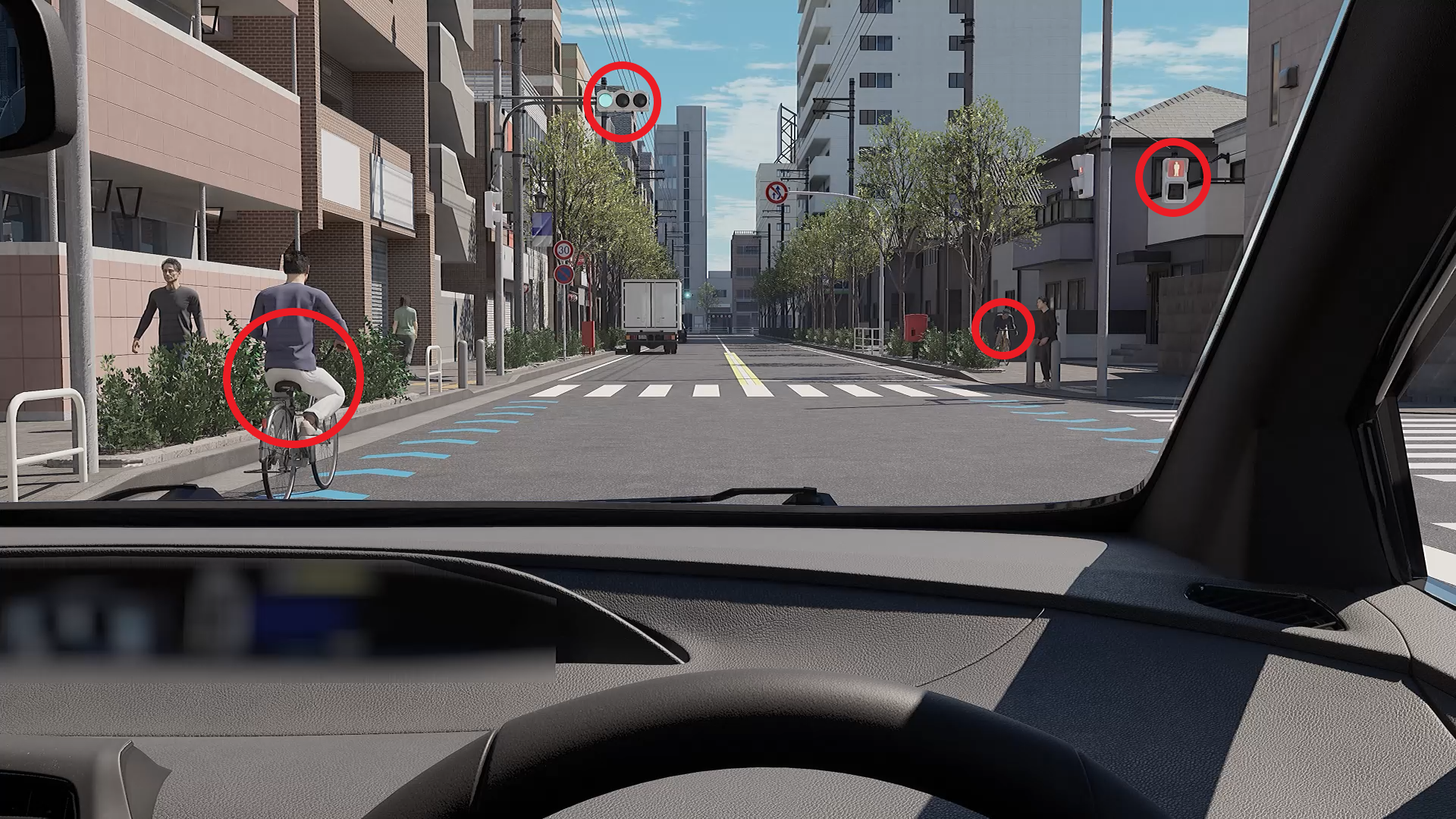 左側の自転車の斜め横断。歩道を走る自転車が車道を渡って来る。歩行者信号は赤だが、車両用信号は青。