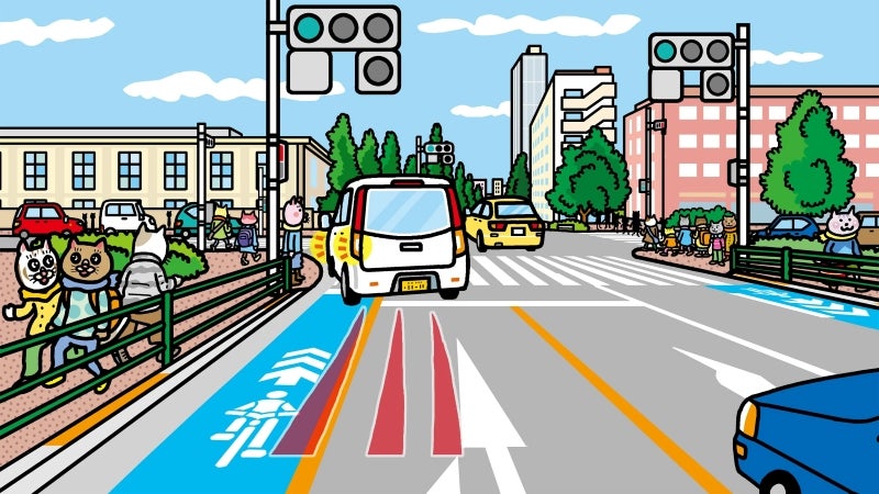 自転車専用通行帯の黄色のラインの中に入って左折するクルマ
